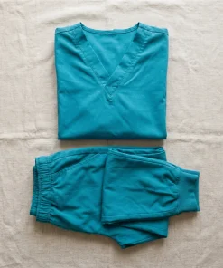 LumiScrubs coordinated teal scrub set, top and matching pant flat-lay