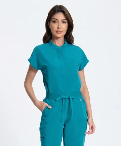 Model wearing the Caribbean Teal Soft Crew mock-neck scrub top