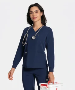 Model wearing the navy long-sleeve underlayer scrub top with a stethoscope