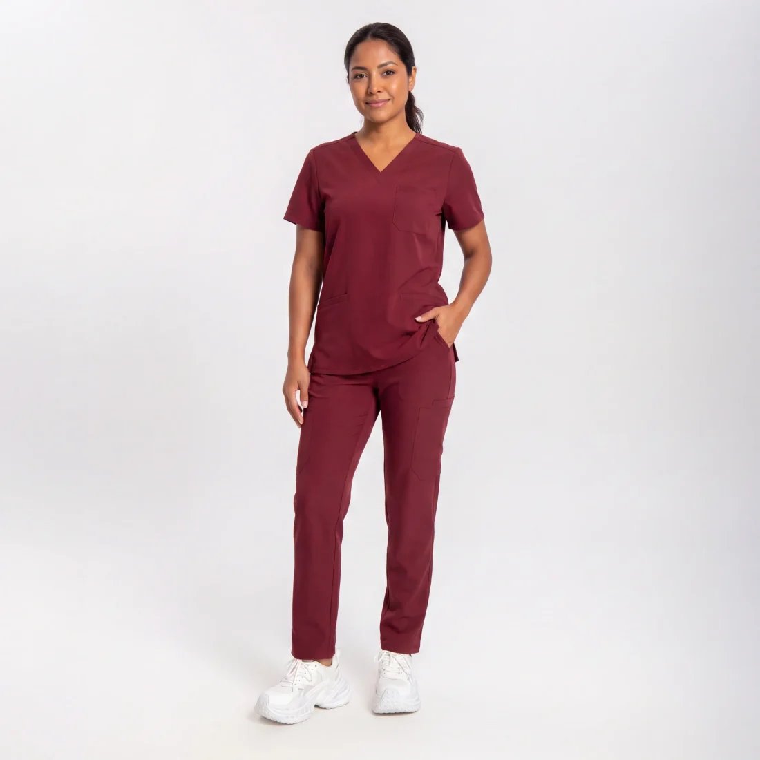 Lumi Core Scrub Set Women's — Burgundy, model wearing V-neck top and straight-leg pants