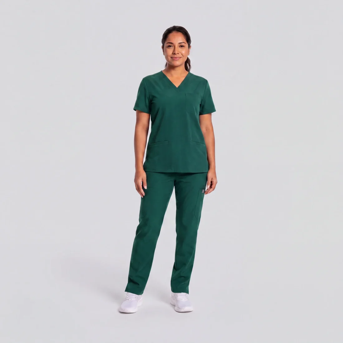 Lumi Core Scrub Set Women's — Hunter Green, model wearing V-neck top and straight-leg pants