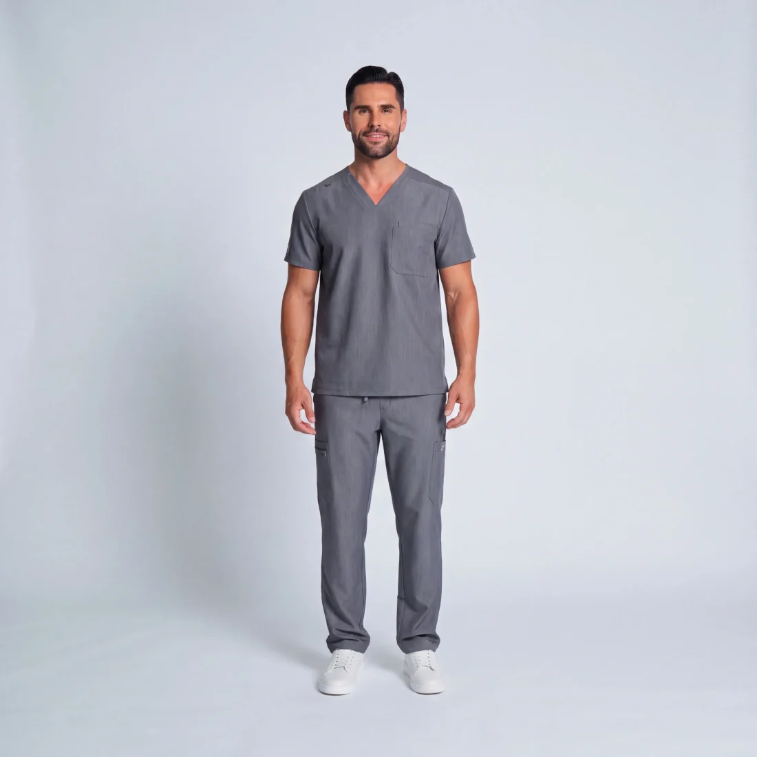Men's Lumi Core Scrubs — Graphite, model wearing V-neck top and straight-leg pants