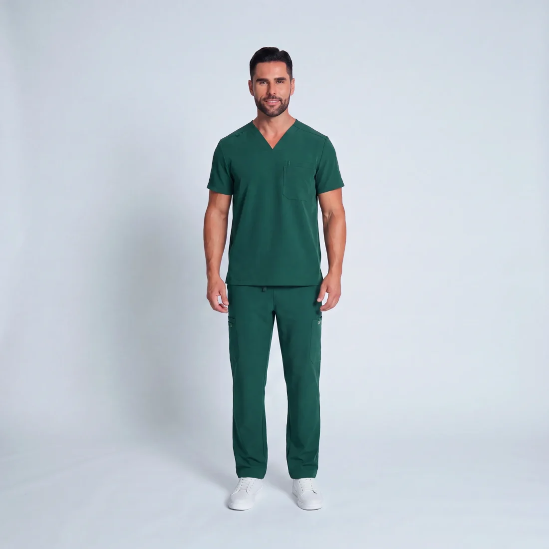 Men's Lumi Core Scrubs — Hunter Green, model wearing V-neck top and straight-leg pants