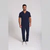 Men's Lumi Core Scrubs — Navy, model wearing V-neck top and straight-leg pants