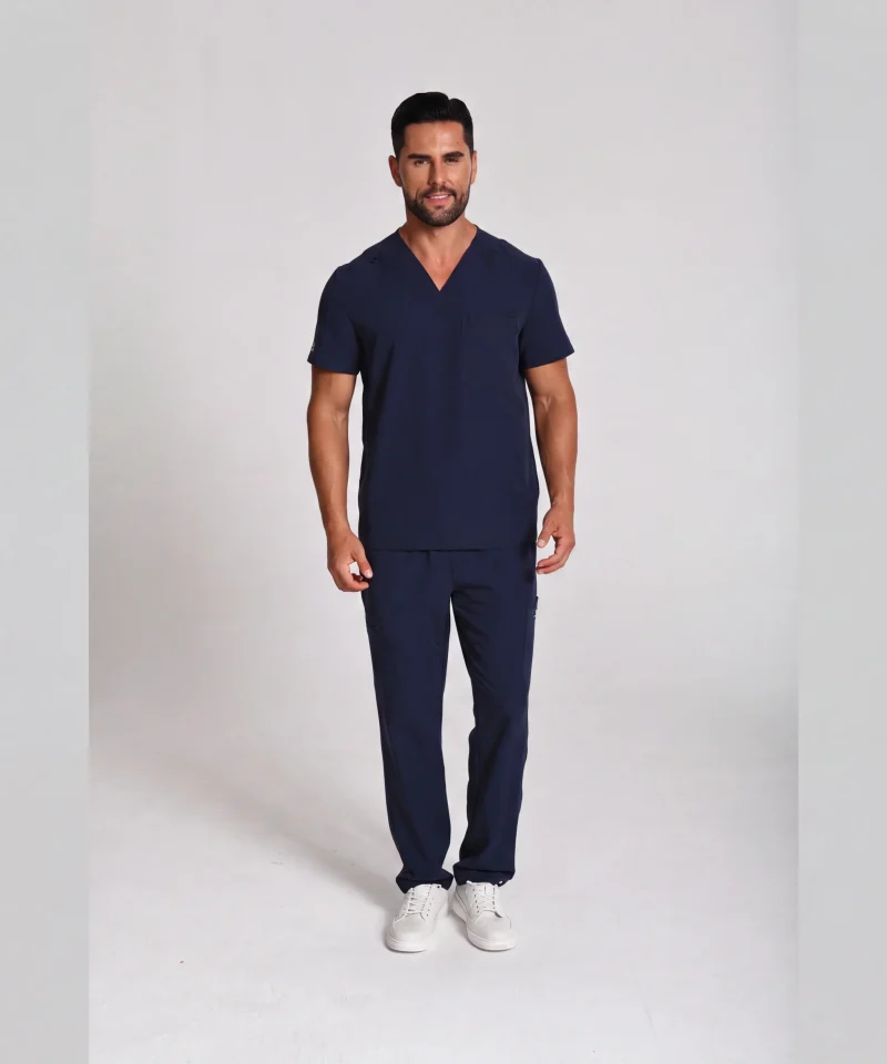 Men's Lumi Core Scrubs — Navy, model wearing V-neck top and straight-leg pants
