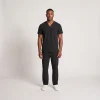 Men's Lumi Core Scrubs — Black, model wearing V-neck top and straight-leg pants