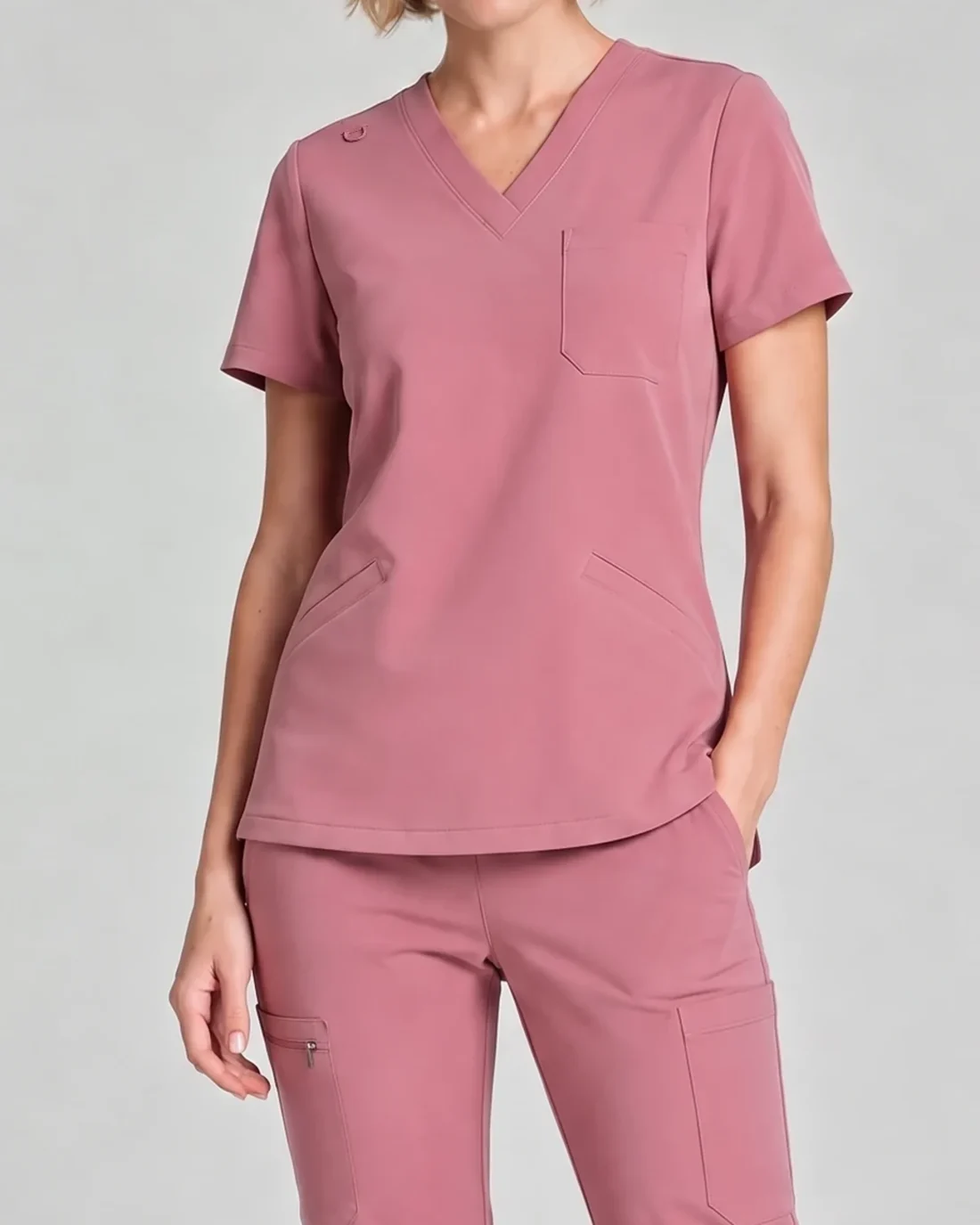 Mauve Core scrub set showing the neckline, pockets and garment detail