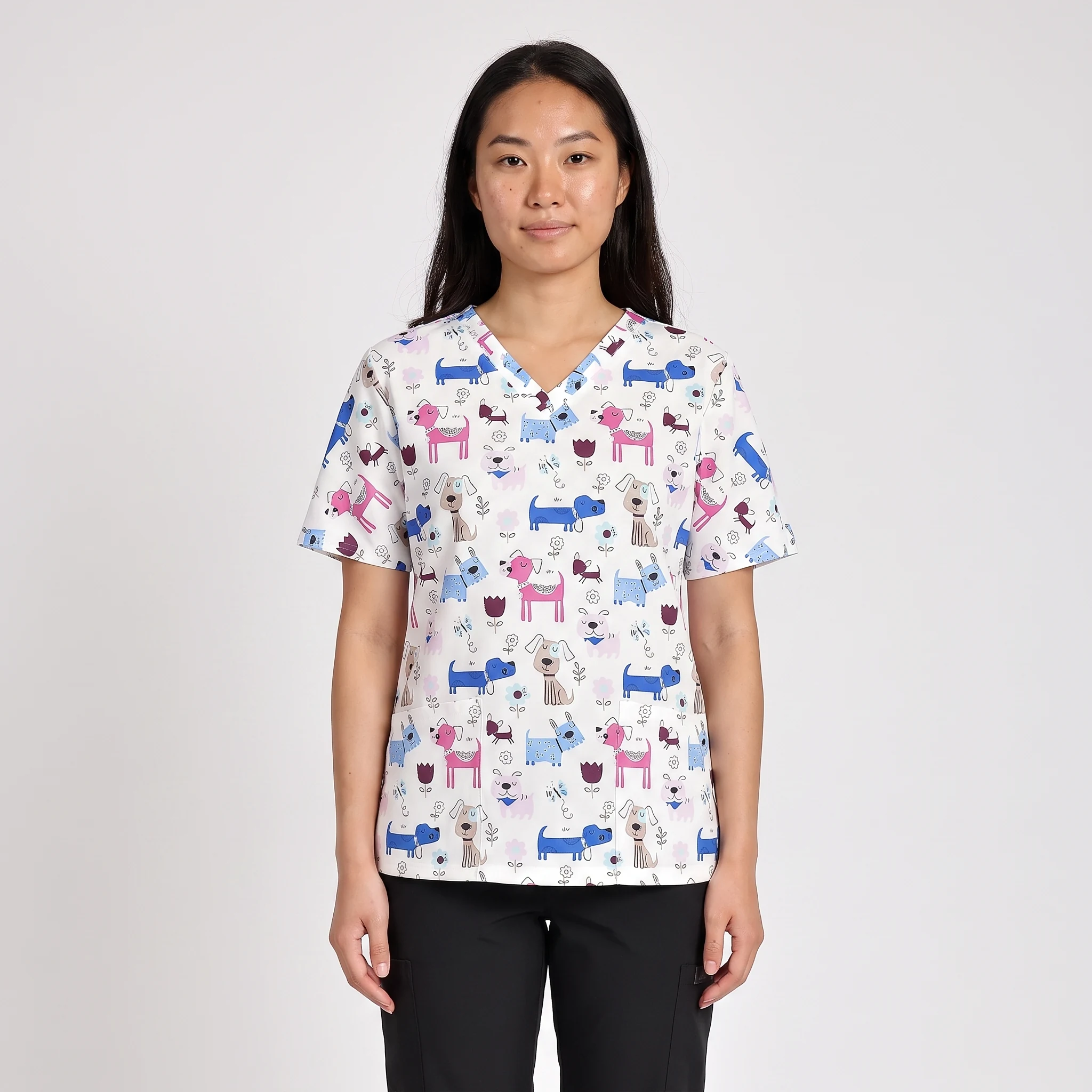 Woman wearing the CarePrint Soft Top with a dog print, front view showing the V-neck, sleeves, and print placement