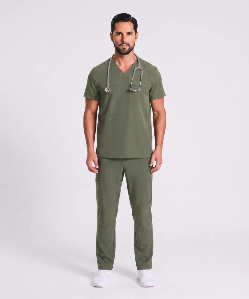 Man wearing the Lumi Motion scrub set in Moss, full-figure front view
