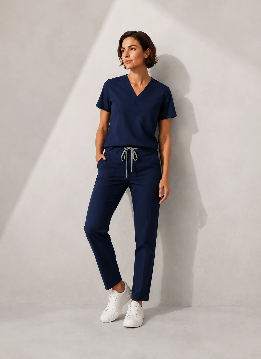 Navy scrub outfit in soft window light