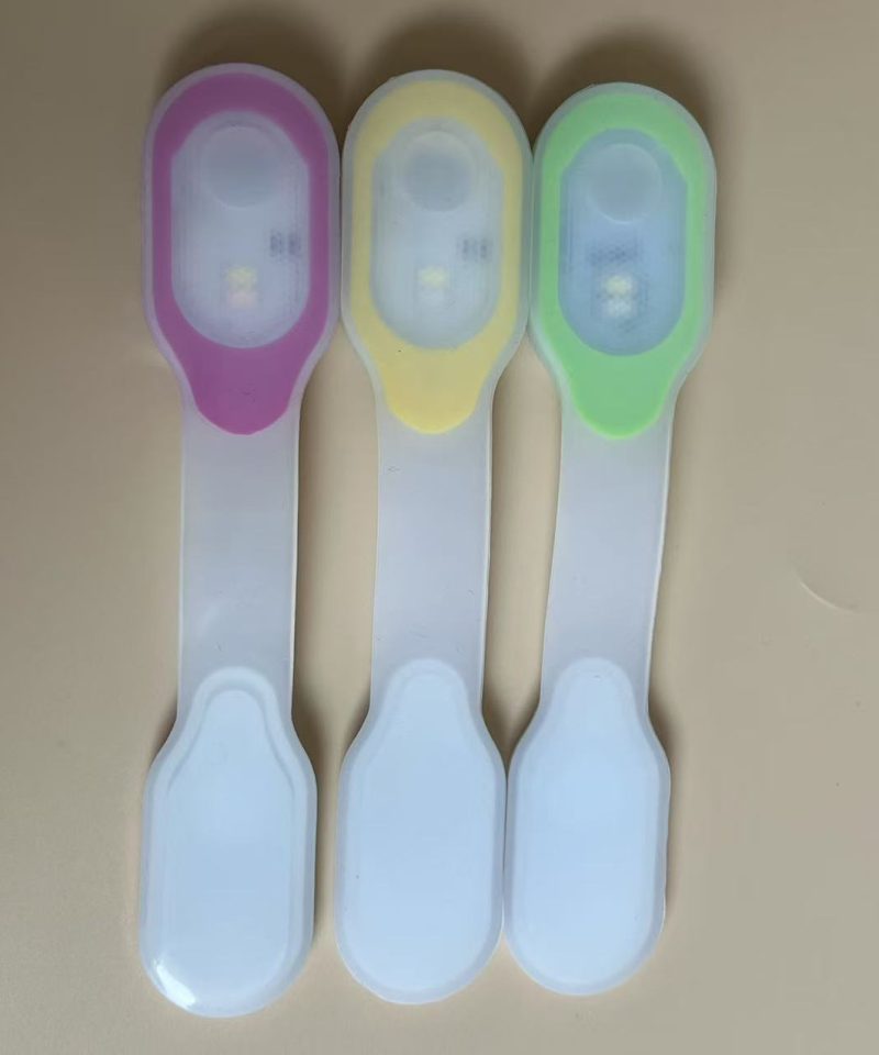 Clip light with the magnetic strap open - pink, yellow and green