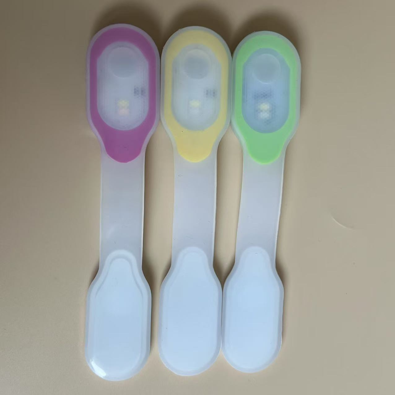 Clip light with the magnetic strap open - pink, yellow and green