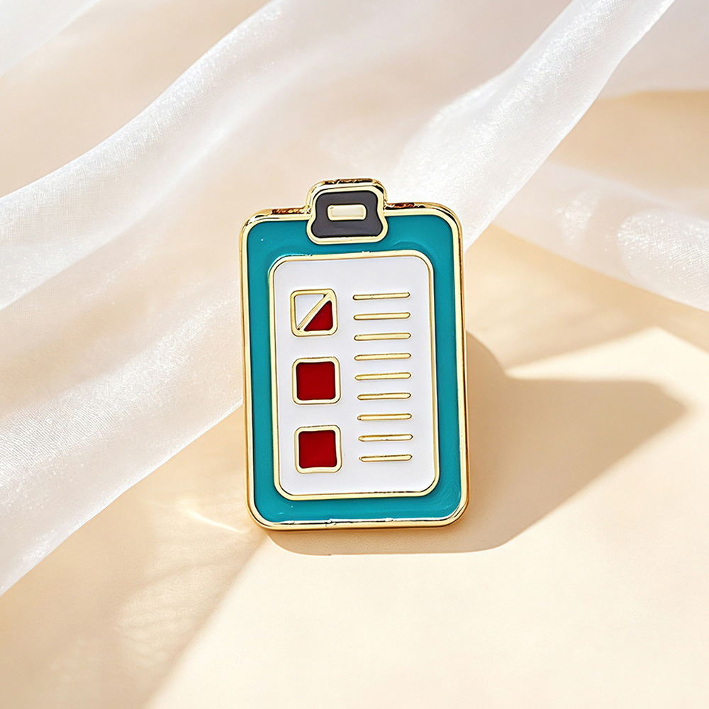 Teal clipboard chart enamel pin with a checklist face