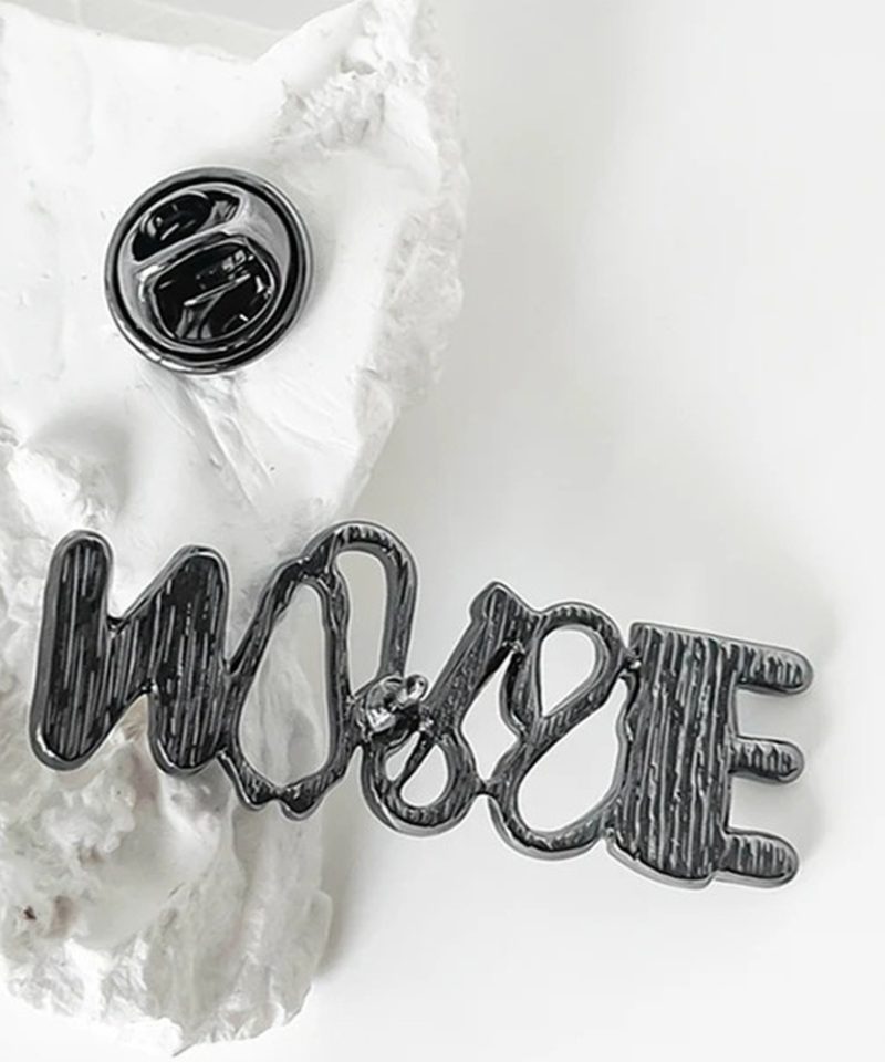 Back of the NURSE pin in black nickel, shown with its butterfly clutch