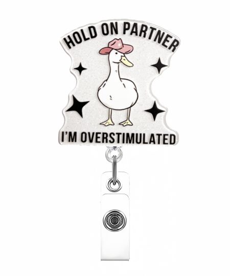 Cowboy goose badge reel reading Hold On Partner, I'm Overstimulated