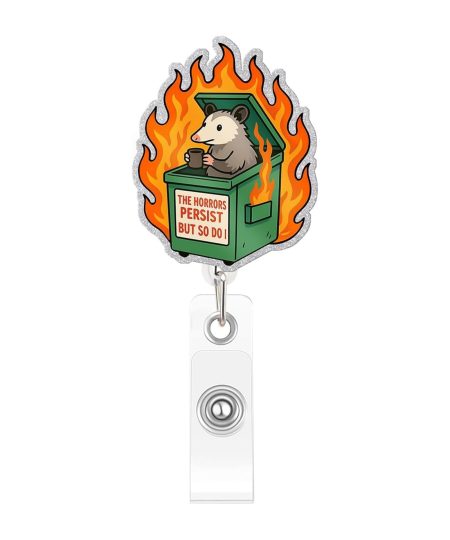 Opossum badge reel reading The Horrors Persist But So Do I