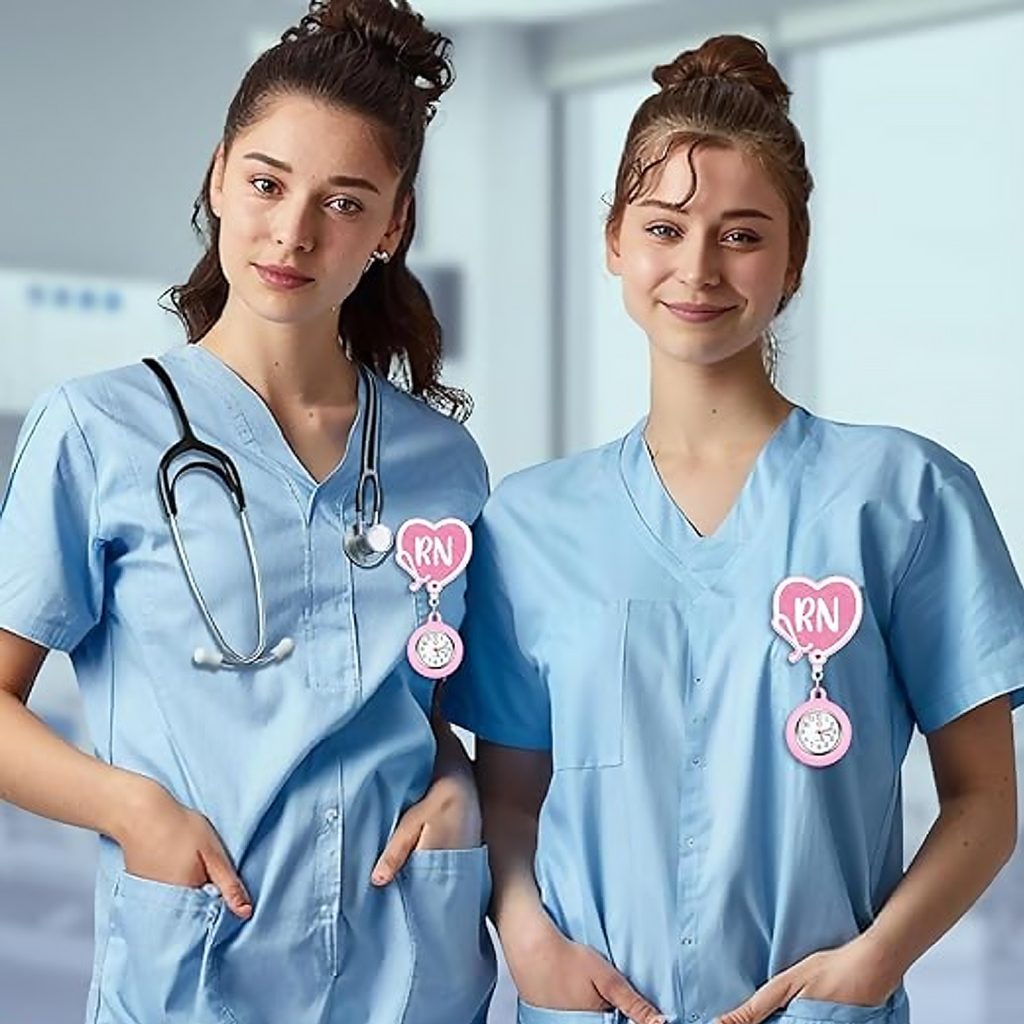 Two clinicians wearing RN fob watches on scrub tops