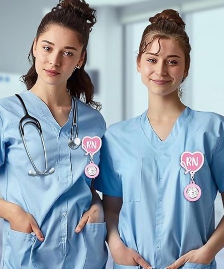 Two clinicians wearing RN fob watches on scrub tops