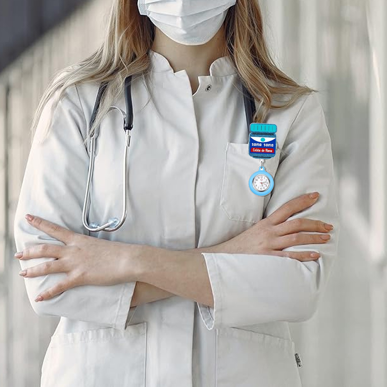 Fob watch clipped to a lab coat pocket